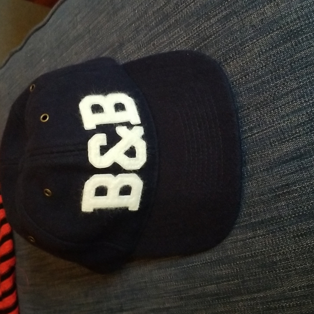 Men's Ball and Buck Wool cap. Leather adjustable strap. Camo lid